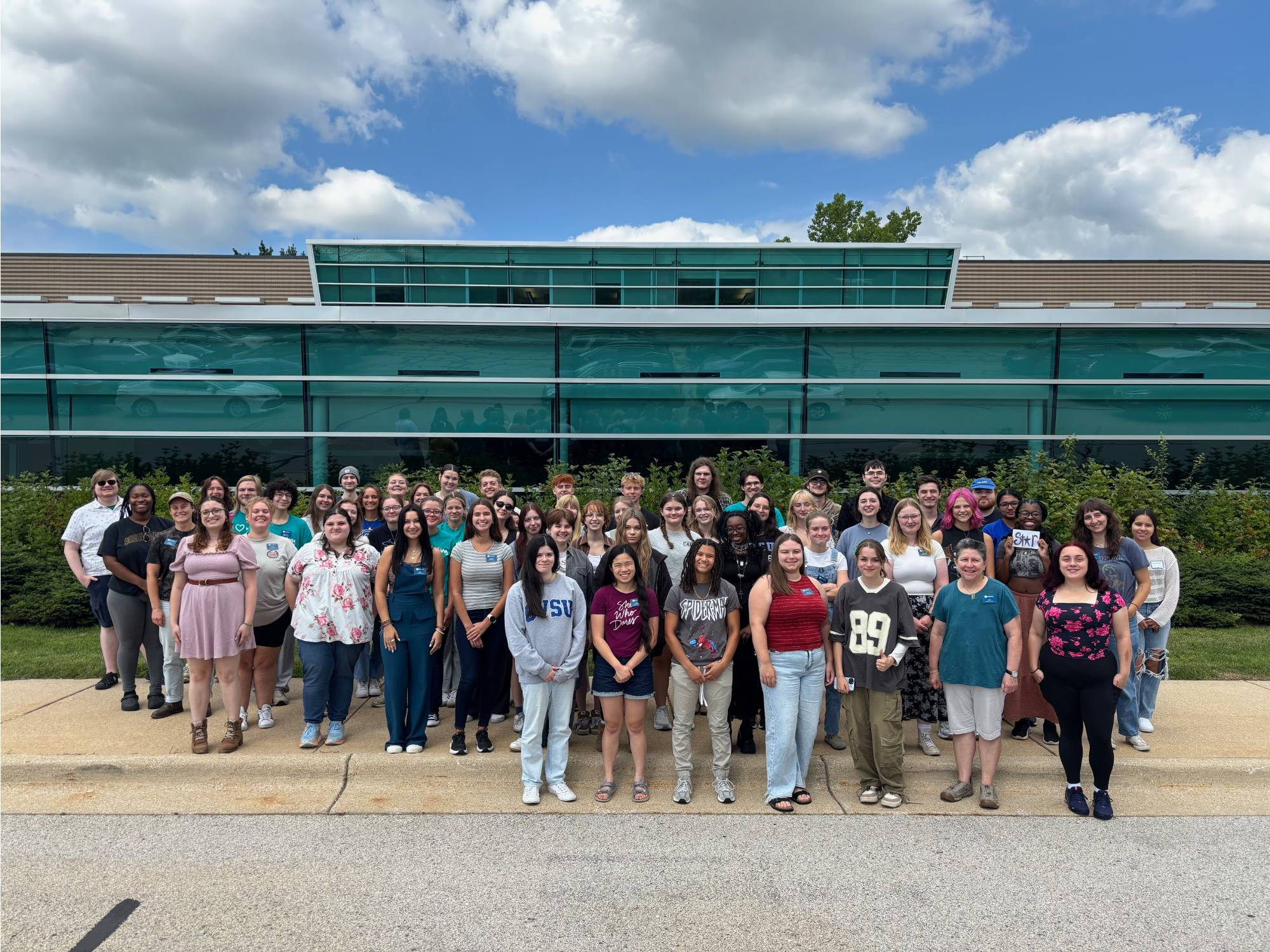 The 2025-2026 Writing Center Staff in front of Lake Ontario Hall